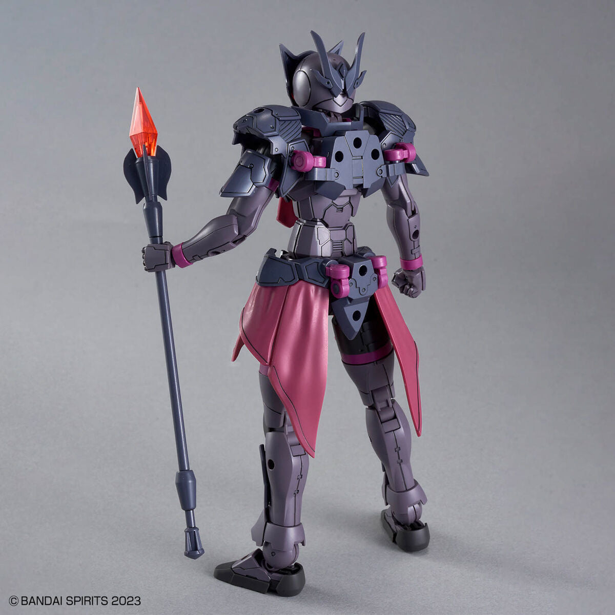 30MF Rosan Priest figure with a pink cape and spear on a gray background