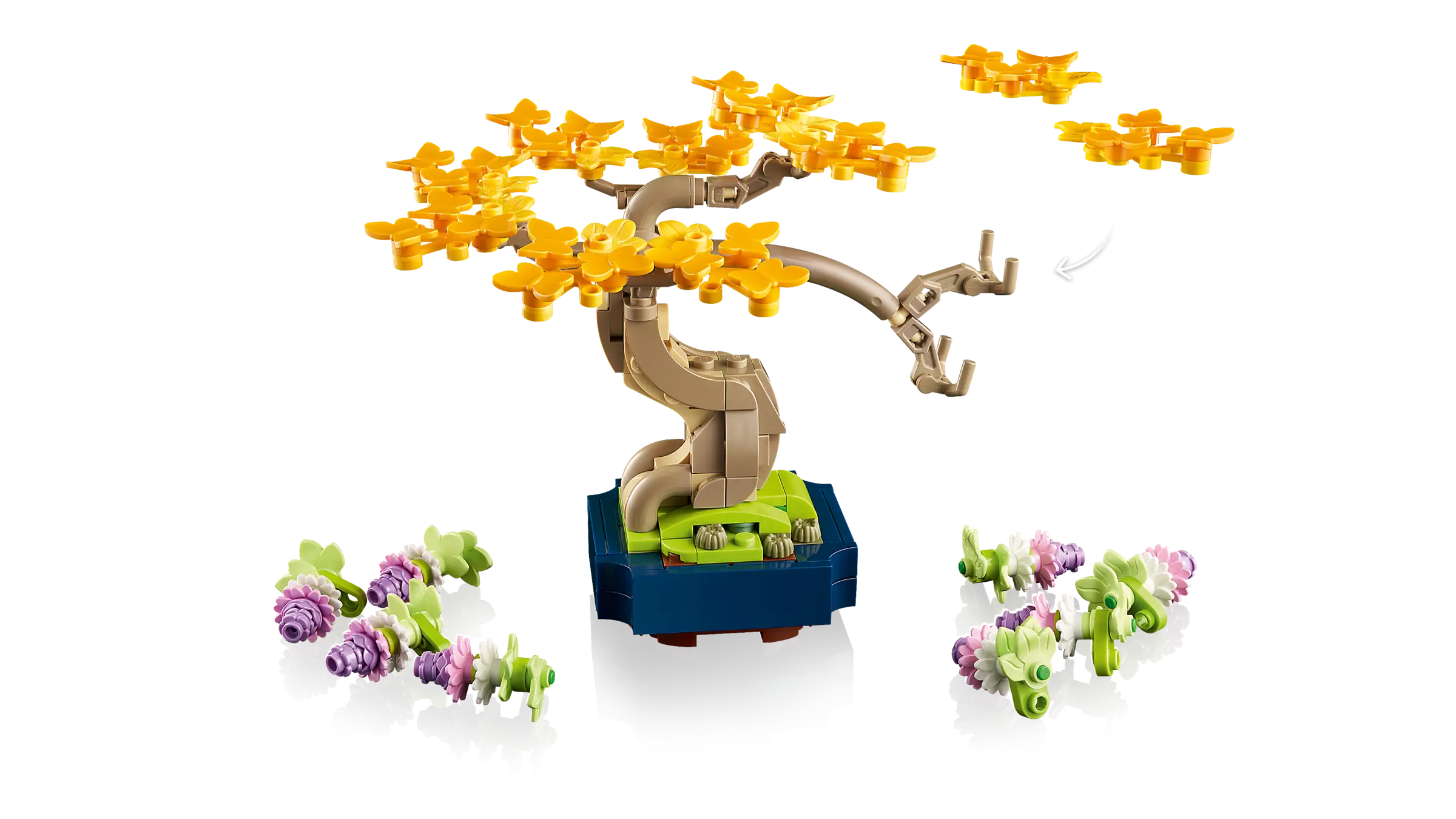 LEGO bonsai tree set with yellow flowers and small plants on a white background
