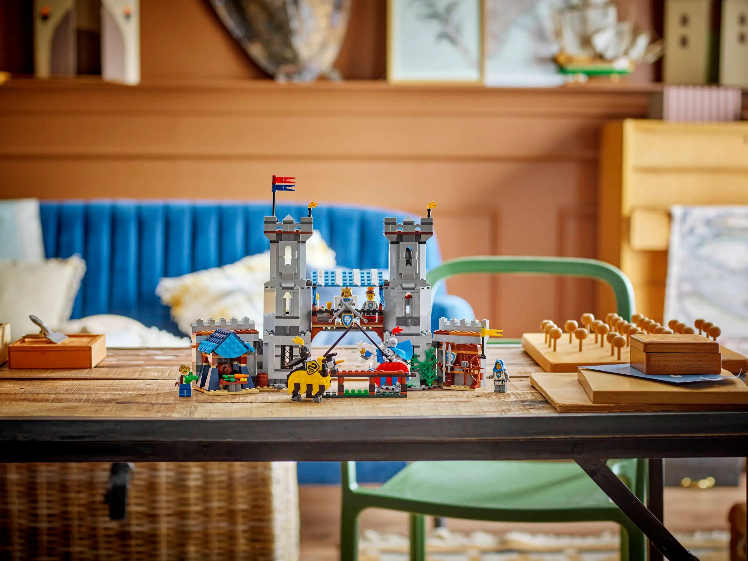 LEGO 31168 Medieval Horse Knight Castle set on a table with a cozy room background