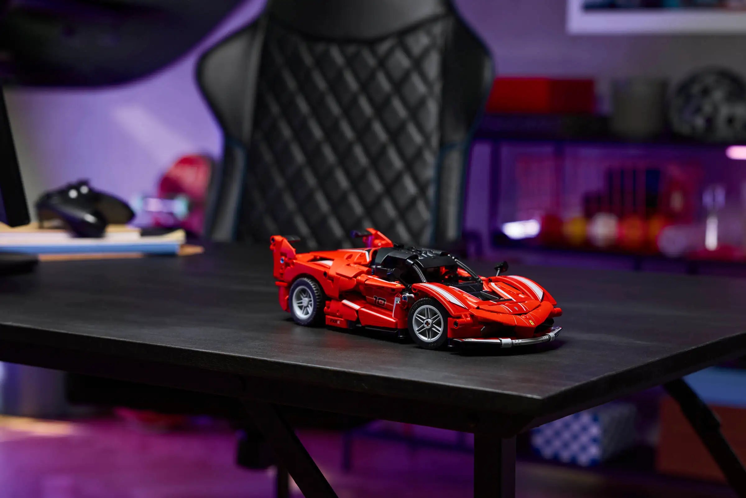 LEGO 42212 Ferrari FXX K Red sport car on a desk with a blurred background