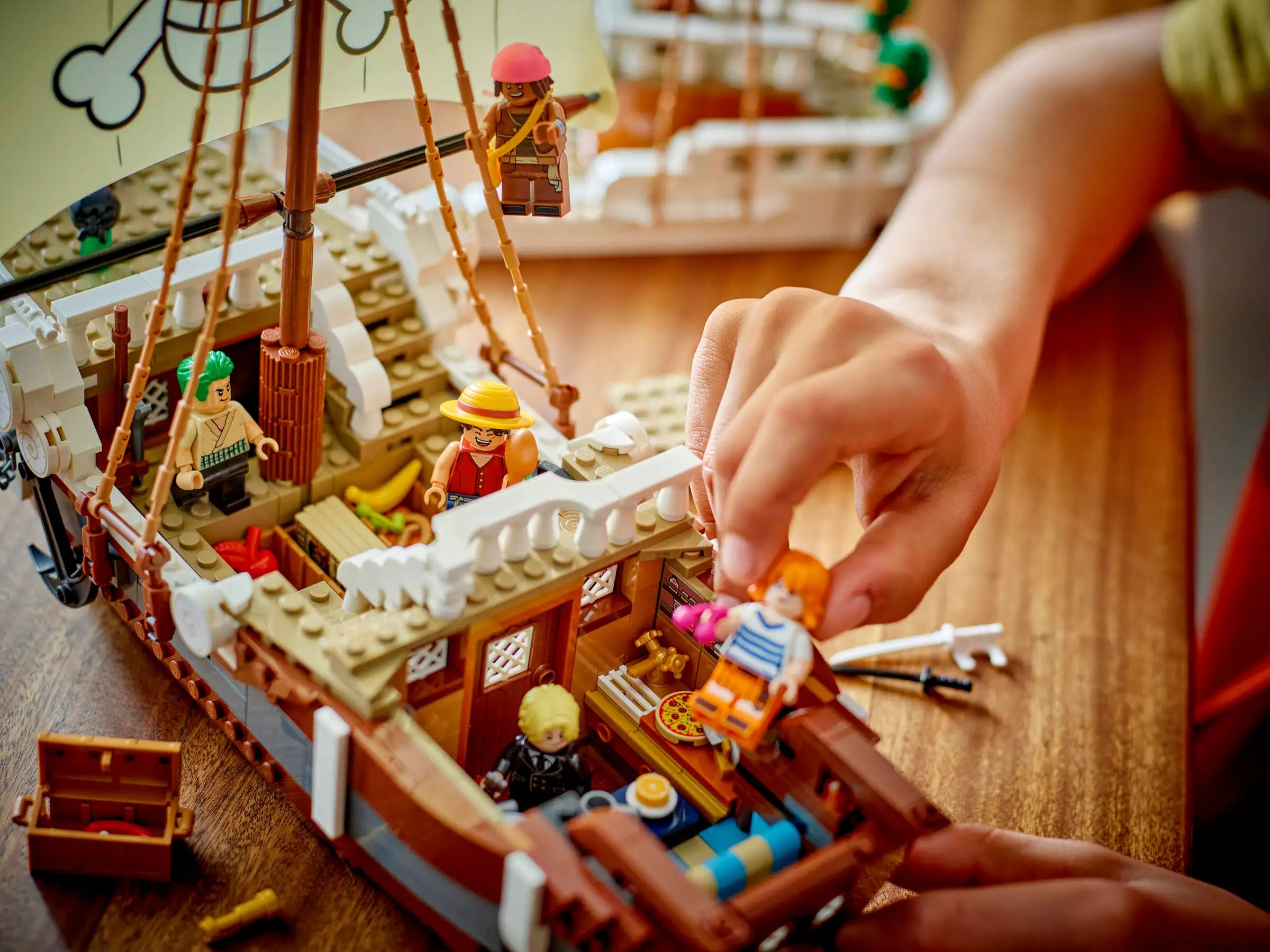 LEGO 75639 The Going Merry Pirate Ship model with minifigures on a wooden table