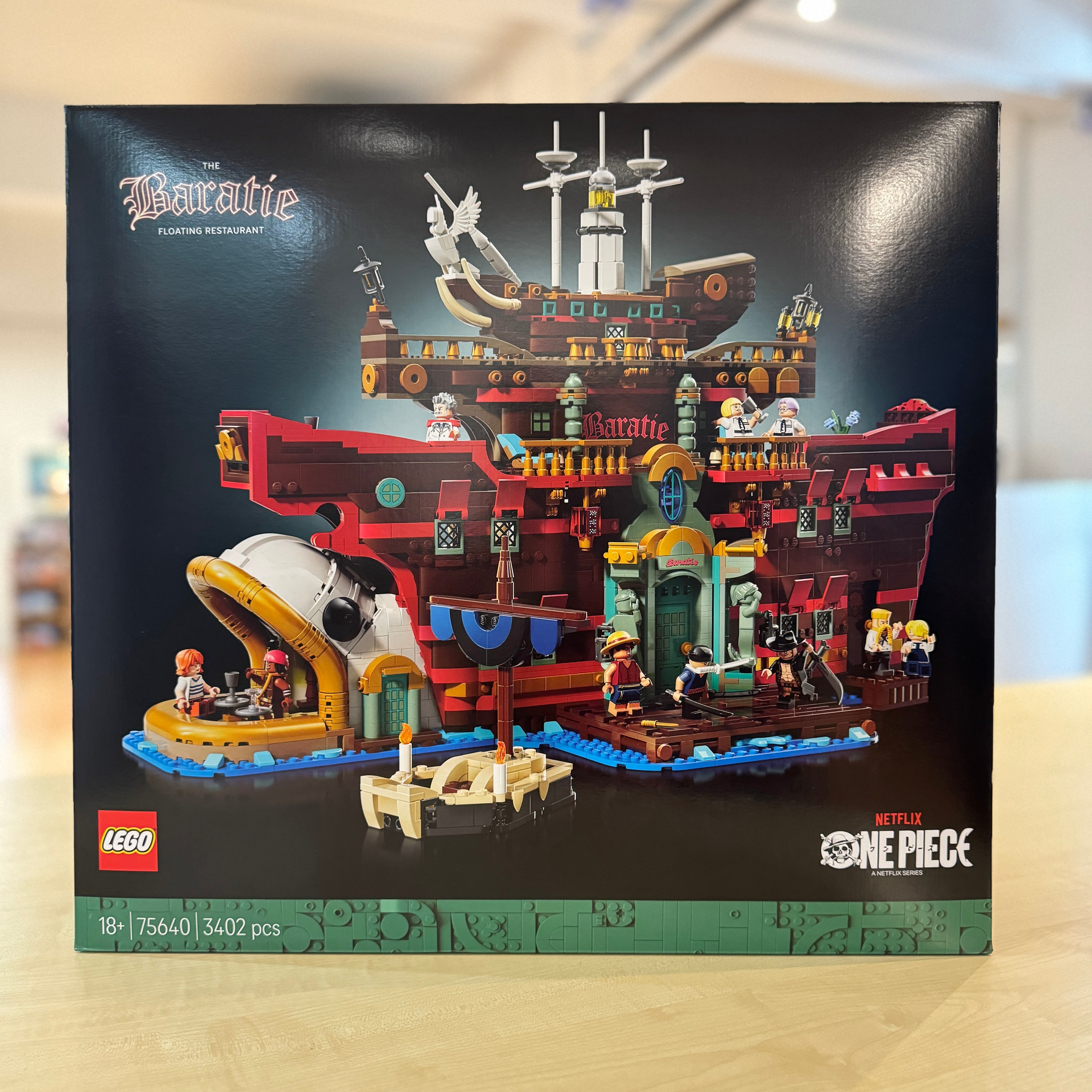 LEGO 75640 The Baratie Floating Restaurant set packaging with detailed ship illustration on a black background
