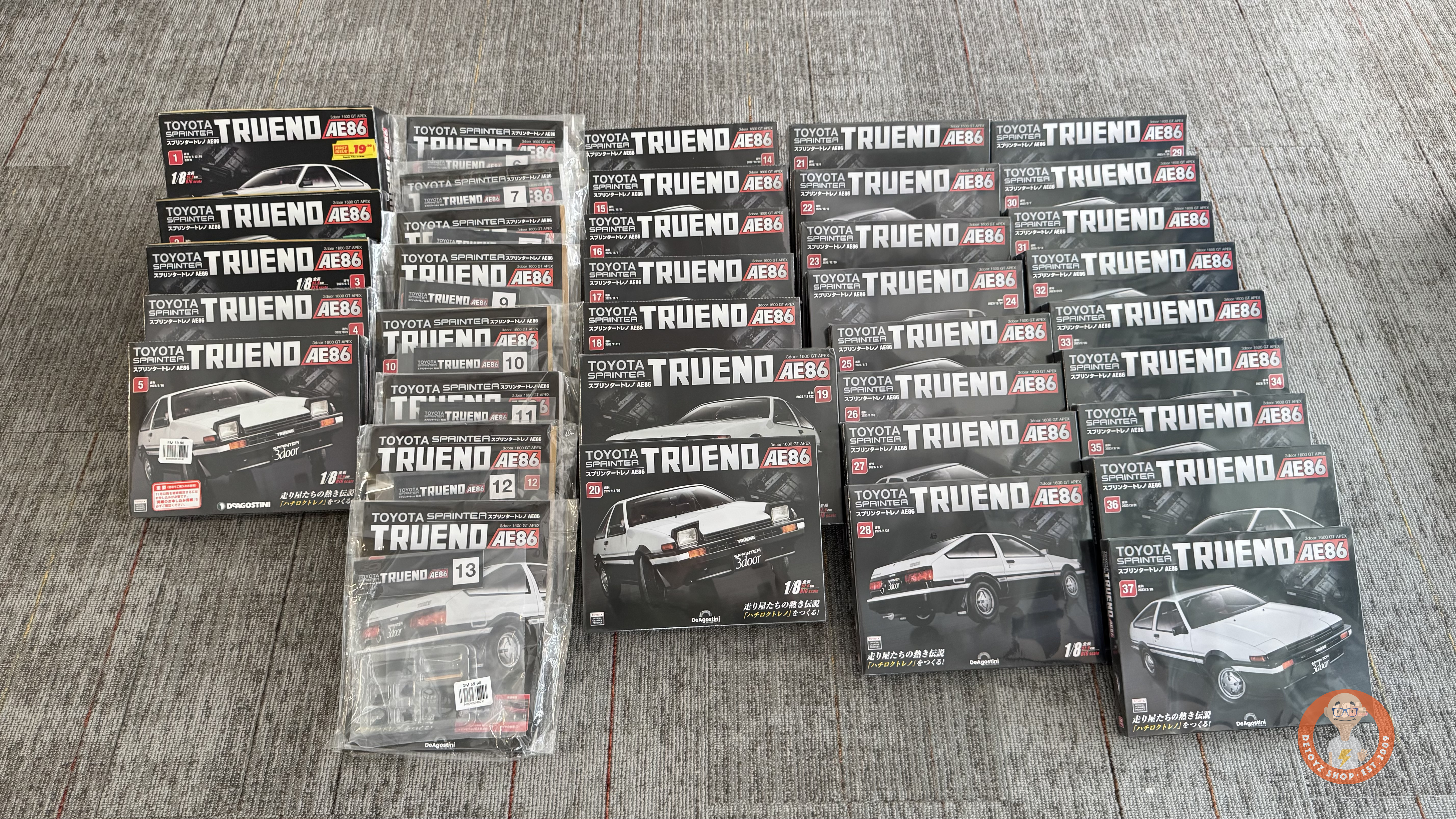 DeAgostini 1/8 Toyota Trueno AE86 Issues 1–37 arranged before the full build begins
