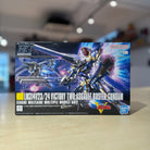 Model kit packaging of a HGUC V2 Assault Buster Gundam on a blurred indoor background