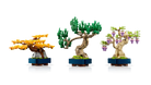 Three LEGO bonsai trees on a white background
