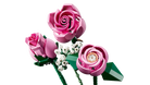Three pink roses made of interlocking bricks on a white background