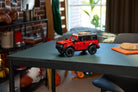LEGO 42213 Ford Bronco SUV on a table in a room with a window and furniture.