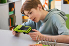 Child playing with LEGO 77237 Dodge Challenger SRT Hellcat car in a classroom setting