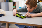 Child playing with LEGO 77237 Dodge Challenger SRT Hellcat on a table