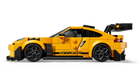 LEGO 77239 Porsche 911 GT3 RS - Yellow sports car model made of interlocking bricks on a white background