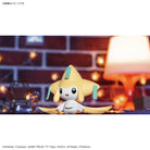 Pokémon Plamo Collection QUICK!! 23 – Jirachi figure of a cute, yellow creature with a white belly on a blurred background